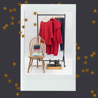 Grey backgorund with gold stars is overlayed with image of chair and clothes rail filled with clothes