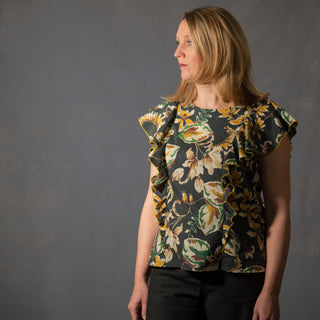 Female wearing the Iris top sewing pattern In a floral fabric