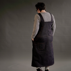 Female showing the back of the Perdita Pinafore Dress Sewing Pattern in Denim