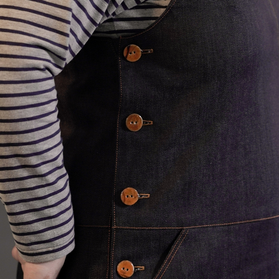 Close up of Tan Cotton Shell Buttons on the Perdita Pinafore Dress Sewing Pattern