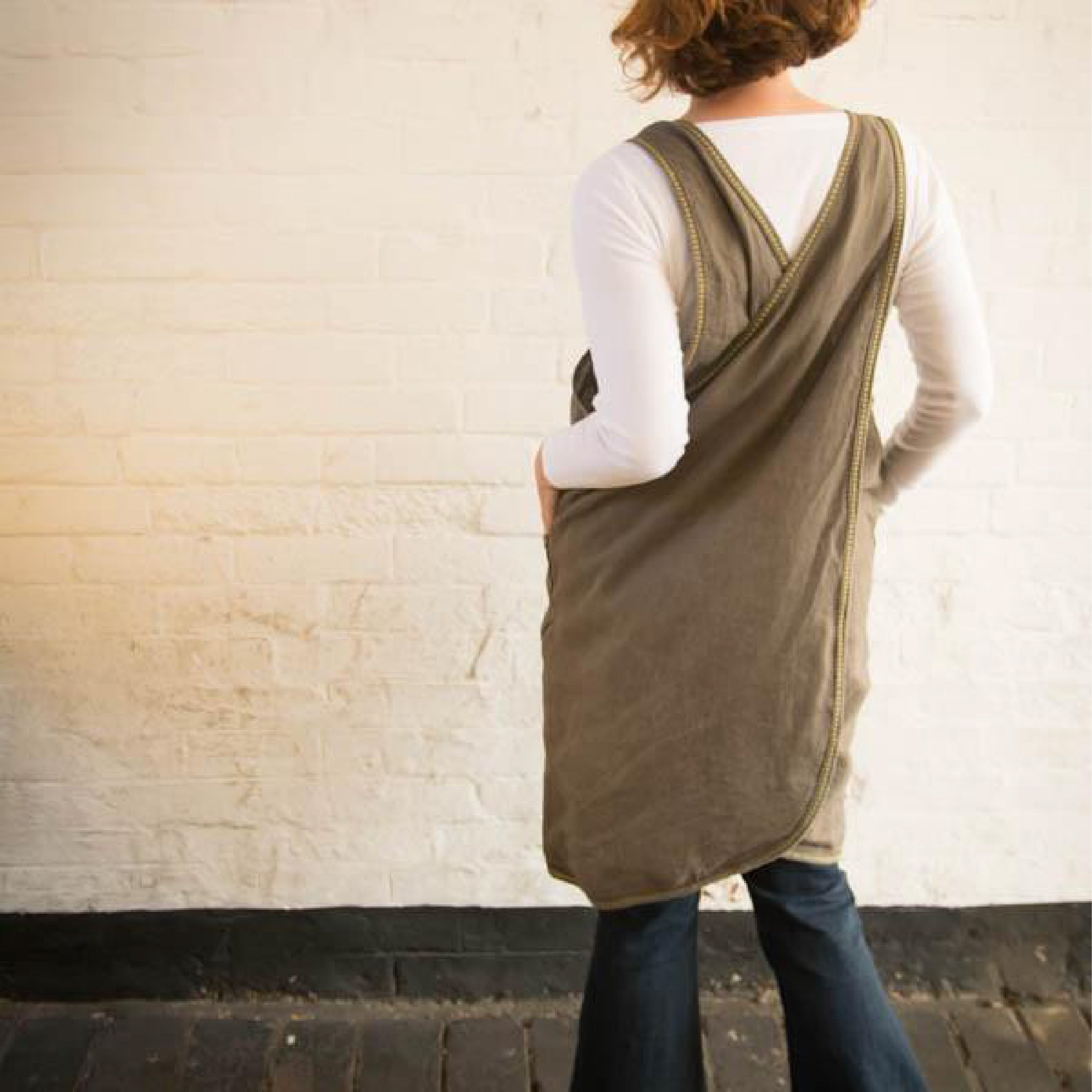 Lady wearing The Beatrice Pinafore Sewing Pattern in A brown fabric
