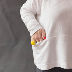 Close up of Female with hand in pocket of the Julia Pocket Top sewing pattern 