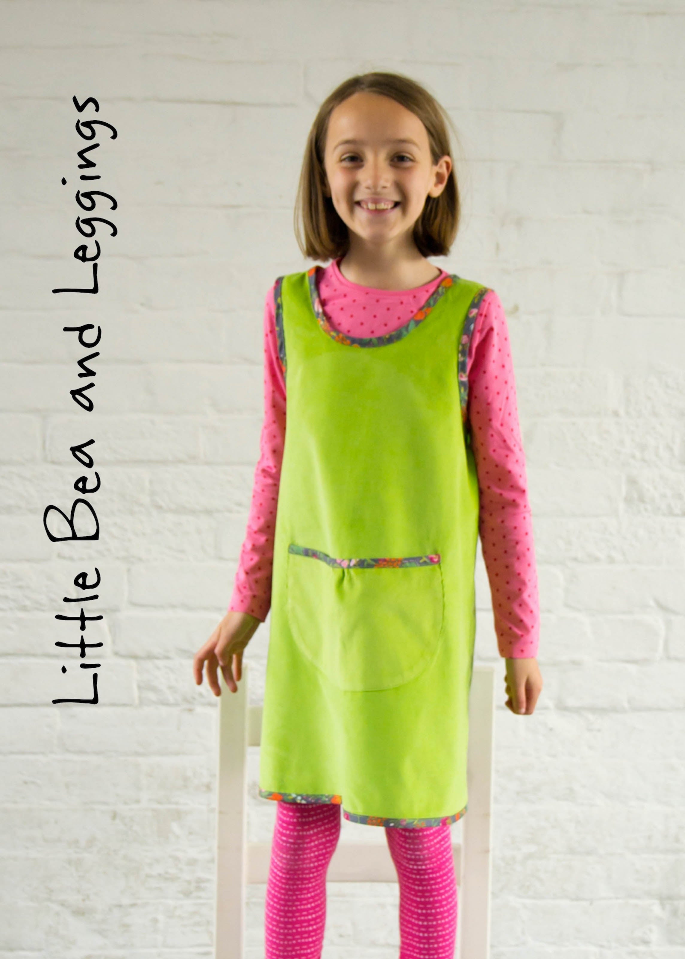 Girl wearing Little Bea and Leggings Sewing Pattern in green and pink fabric